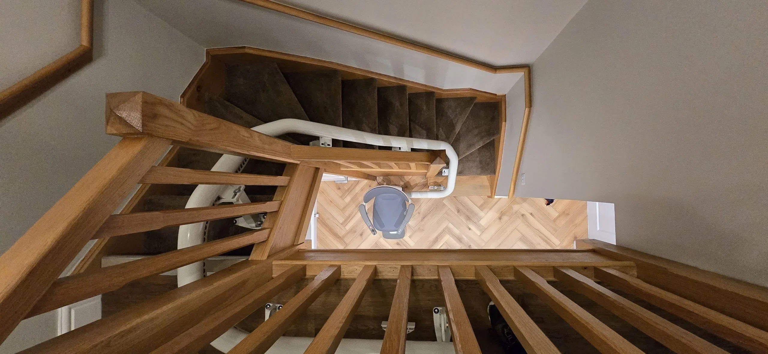 Curved stairlift fitted on a staircase in a Caerphilly home